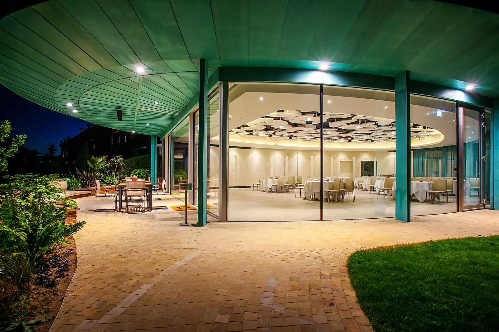 The Grove Hotel Cedar Suite — completed pavilion illuminated at night, luxury five-star hospitality venue