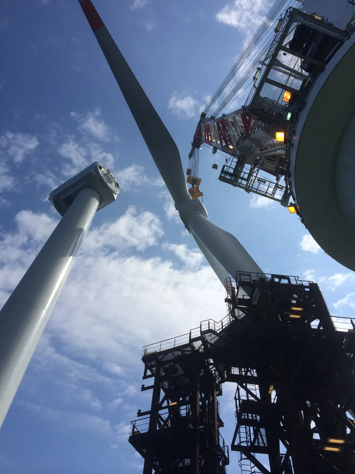 Trianel Windpark Borkum — offshore turbine installation in progress from marine installation vessel, North Sea