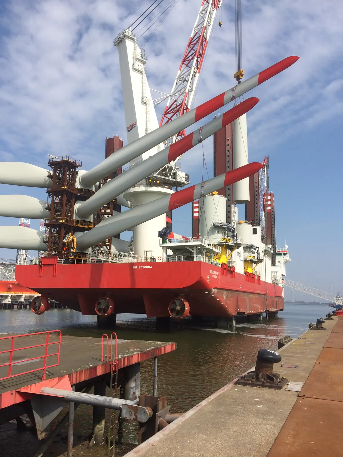 Trianel Windpark Borkum — marine installation vessel with blade stacks loaded for offshore deployment