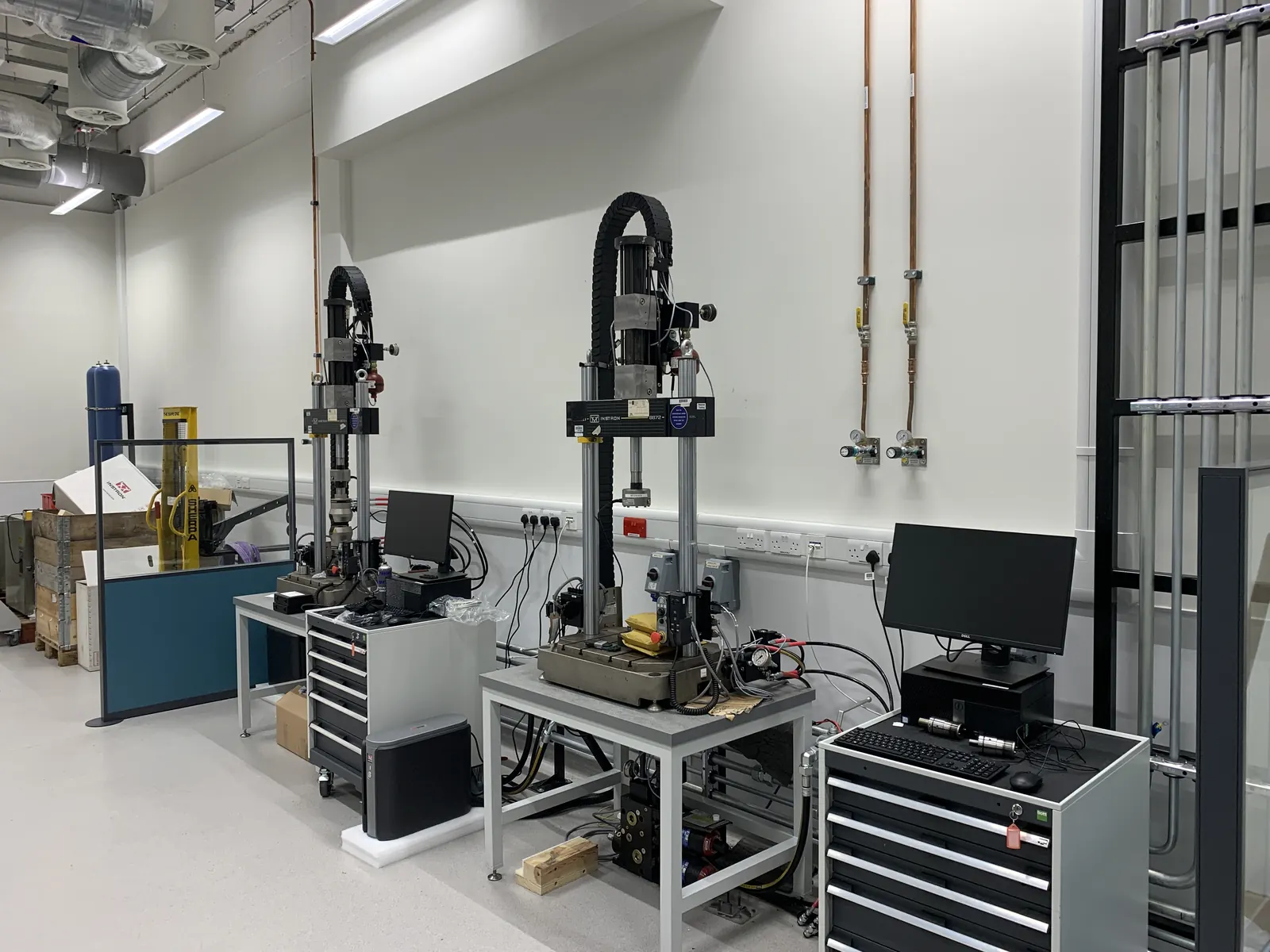 Advanced Materials Testing Facility — multiple high-precision testing rigs in completed laboratory suite