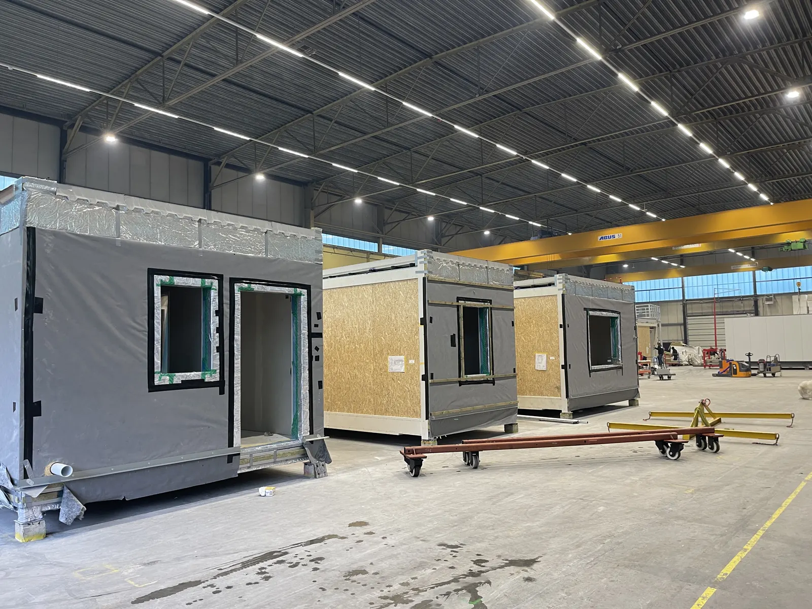 Craig Garbutt — MMC factory: completed and part-clad volumetric units on transport dollies ahead of despatch