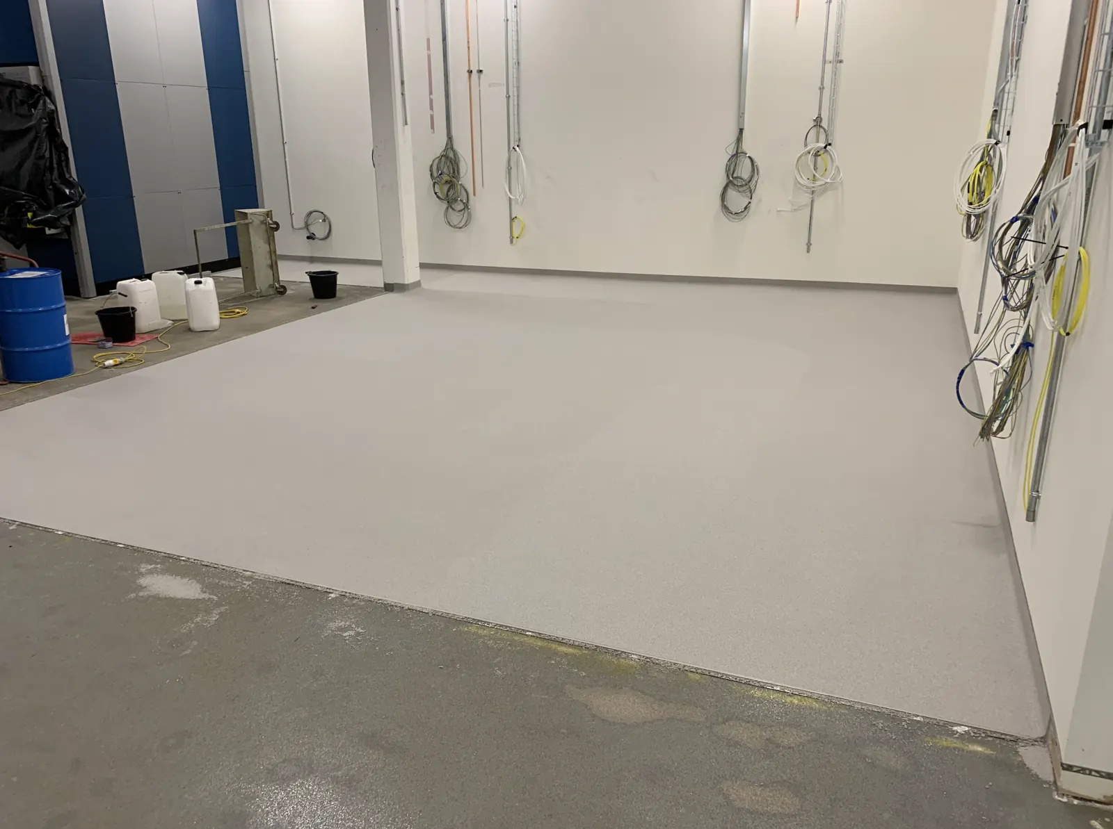 Advanced Materials Testing Facility — resin floor laid with cable containment first-fix installation