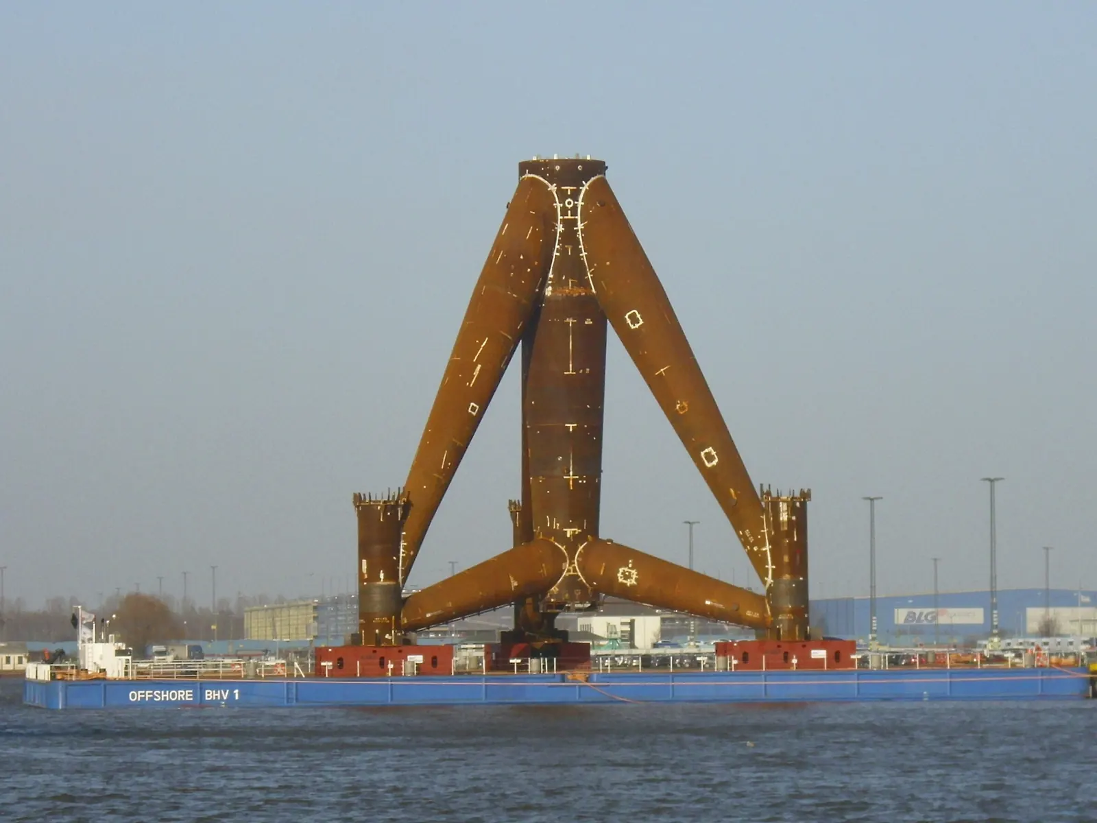 Trianel Windpark Borkum — tripod foundation loaded on heavy-lift barge at Bremerhaven port