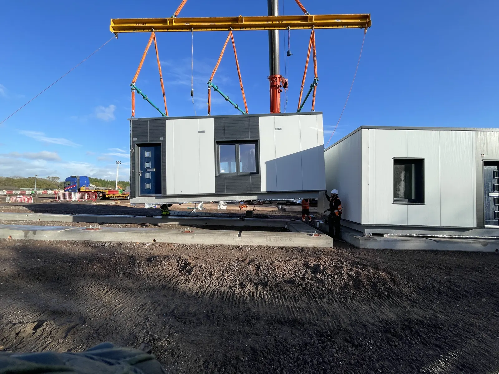 Craig Garbutt — Modern Methods of Construction (MMC) and DfMA: crane lifting prefabricated modular unit on a healthcare construction programme